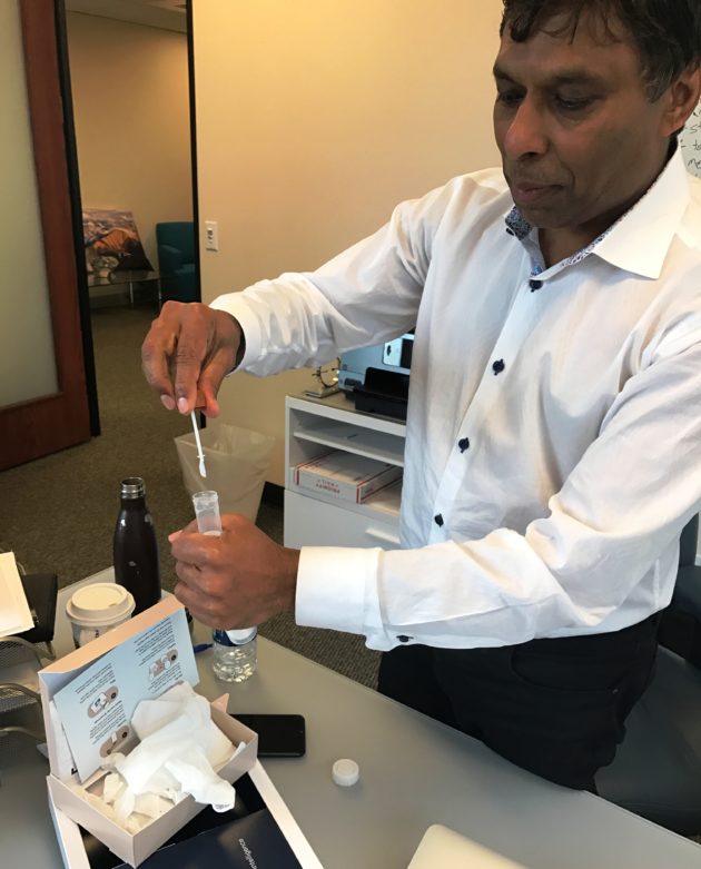 Naveen Jain demonstrating stool sample collection
