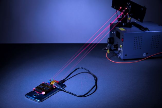Lasers charging smartphone