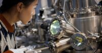 Researcher checking quantum computing hardware