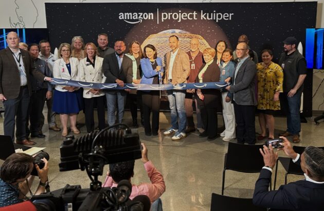 Sen. Maria Cantwell and other VIPs cut the ribbon for Amazon Project Kuiper satellite factory