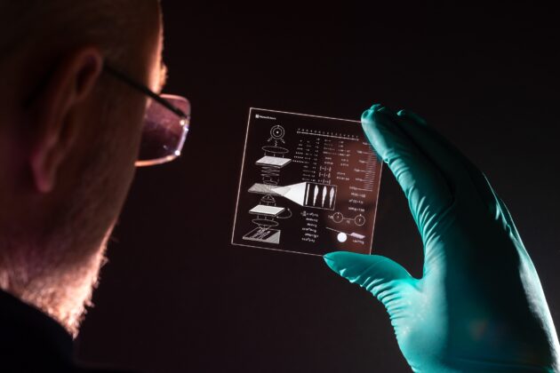 Richard Black holds a Project Silica data storage platter